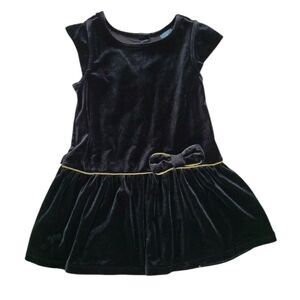 Black velvet dress trimmed in gold piping